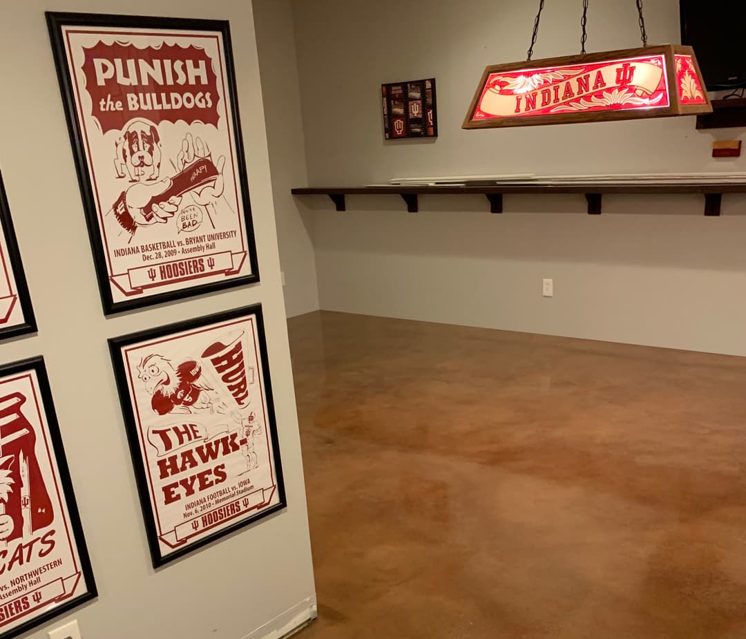 Indiana University-themed sports decor featuring posters and a hanging sign.