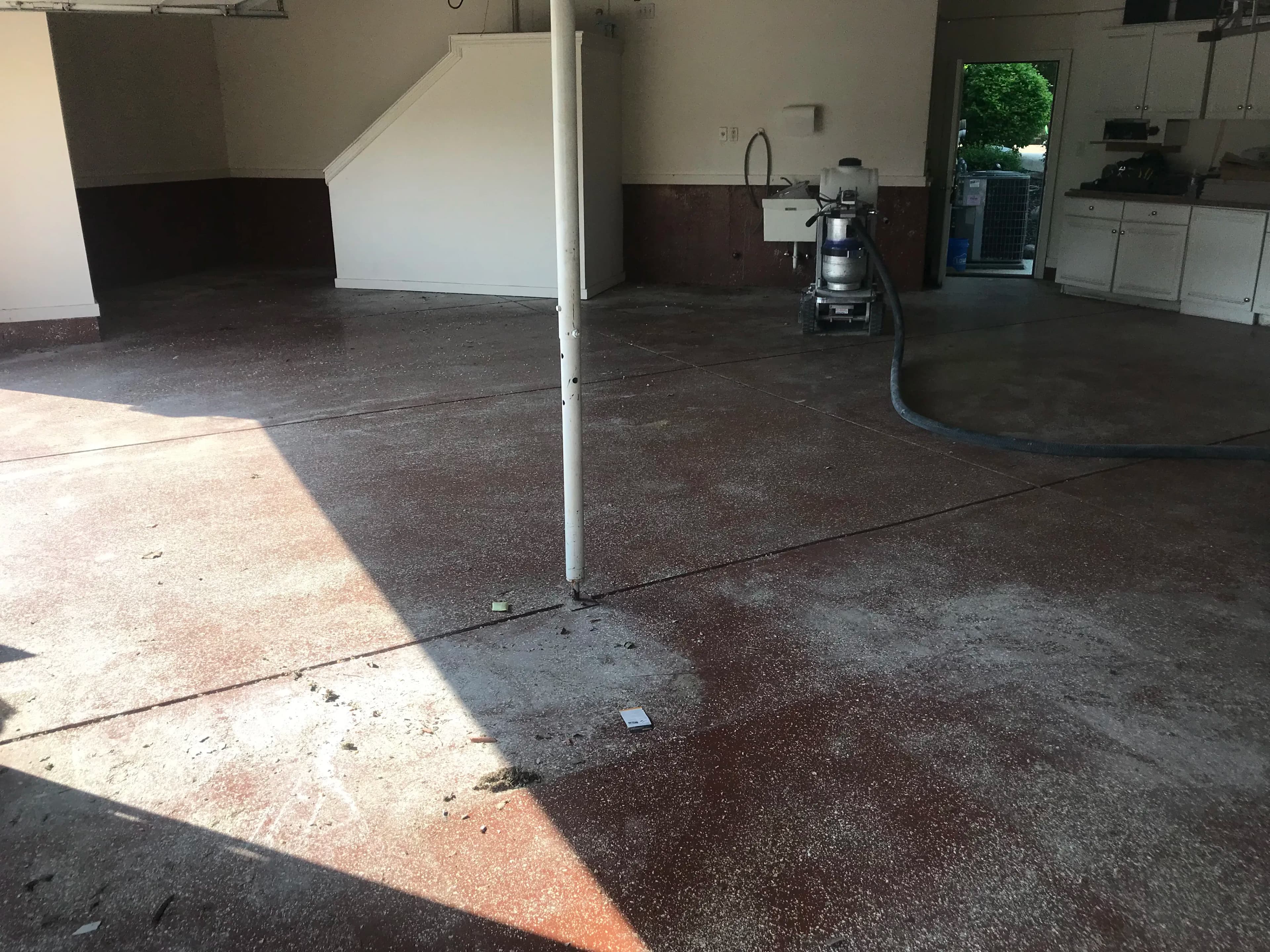 Stained, cracked and pitted concrete